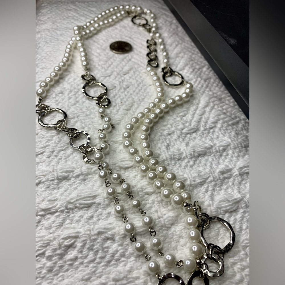 Faux Pearl and silver-toned necklace. Can be worn as a long strand or doubled up